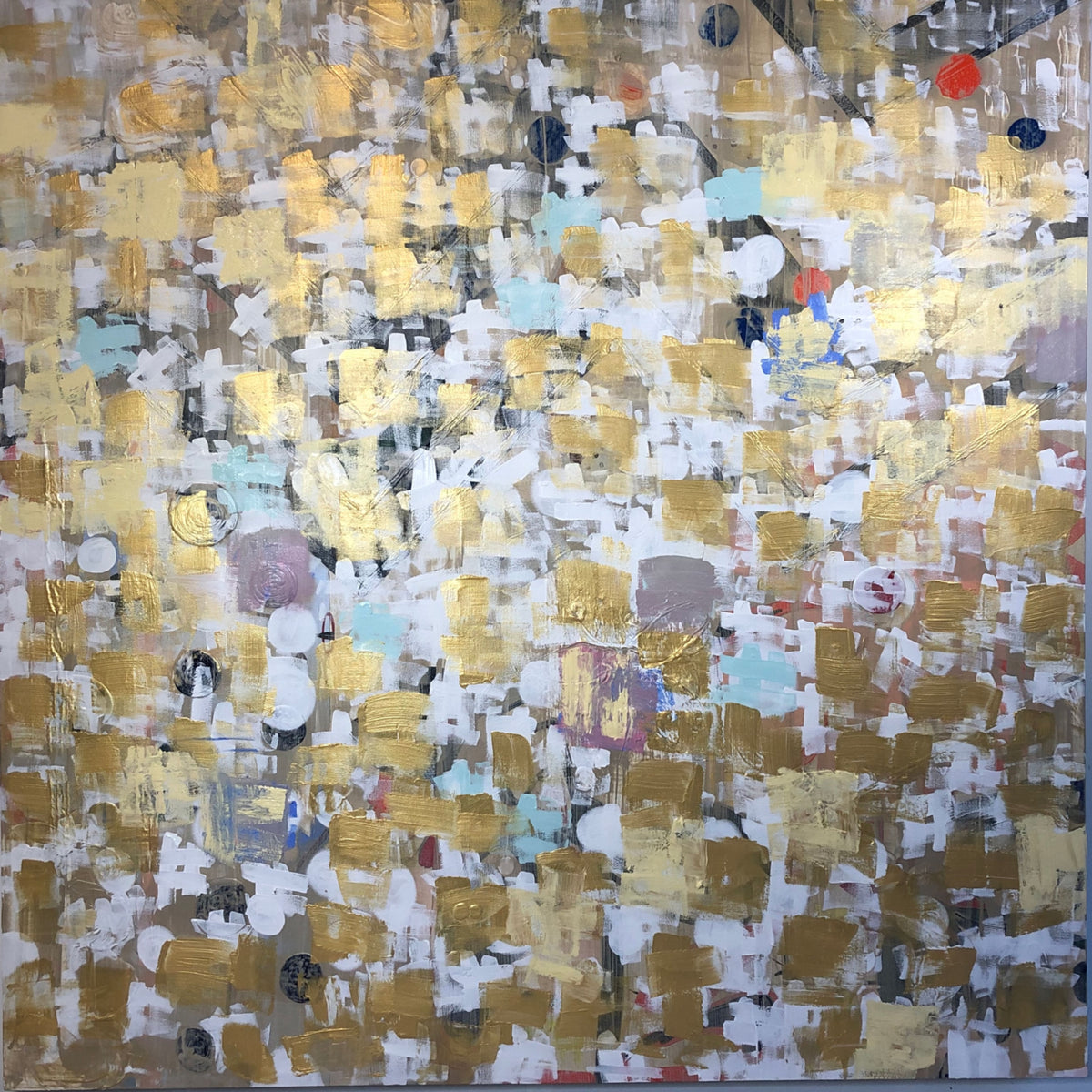 Abstract art piece with a patchwork of gold, white, and multicolor squares. Joan Elan Davis